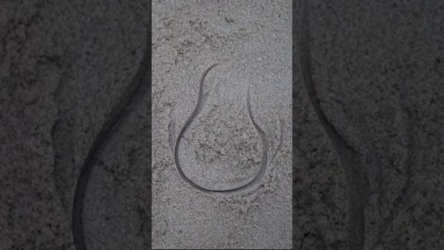 Playing with beach toys and sand molds in the sandbox