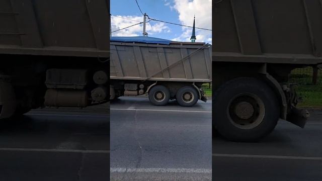Three dump trucks are carrying sand in their backs