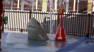 Children's playground: child runs through a maze and slides down a slide