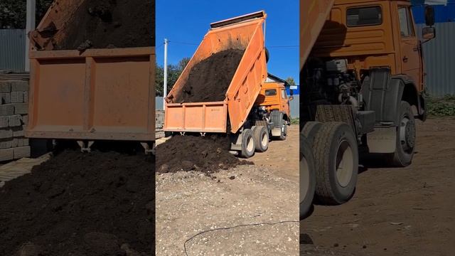A dump truck unloads soil from its body
