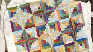 Современная интерпретация стиля «пэчворк» в виде бревенчатой хижины