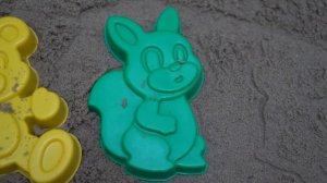 Playing in the sandbox with a plane and a truck made from sand molds