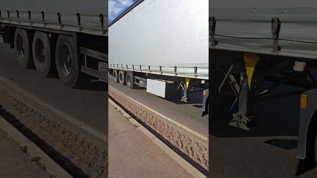 A truck is driving along the road
