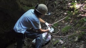 Diving deep into caves to remove 100 years of trash