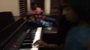 Elisha playing piano