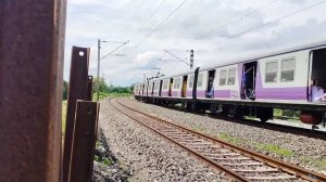 CAT Headed EMU Local Train Passing At Beautiful Curved