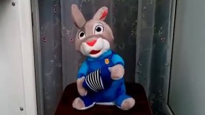 Поющая и танцующая игрушка Заяц-гармонист.