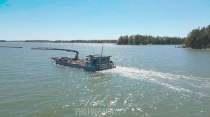 A bulk cargo sea carrier darts between the islands of Finland #finland