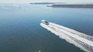 Sea boats from a drone in Helsinki. A boat goes out to the open sea in the center of Helsinki