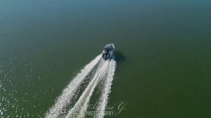 Chasing a boat in sport flight mode. Sea boats from a drone in Finland