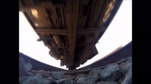 Amtrak train runs over camera