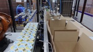 Автоматическое формирование  коробок и  укладка банок- стаканов  Роботом КУКА
