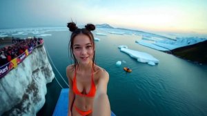 Girls winter cliff diving