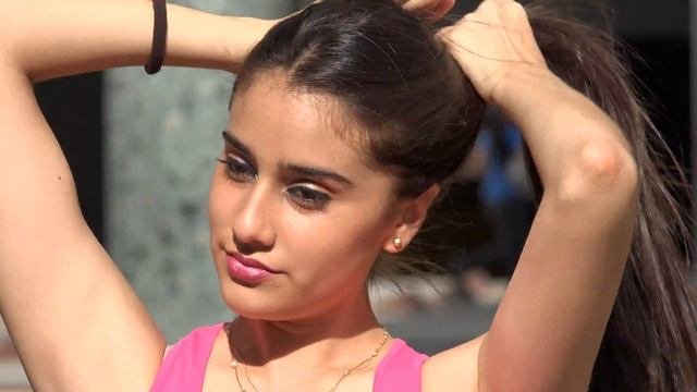 Beautiful Young Teen Girl Fixing Her Hair
