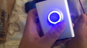 Ring doorbell being charged by power bank