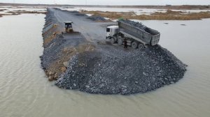 Строительство, дорога через озеро,  новый обзор