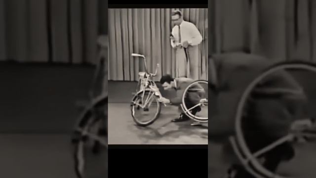 Frank Zappa plays a bicycle on tv