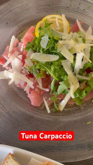 Tuna Carpaccio dressed with olive oil and thinly slices of parmesan cheese shorts viral trendin