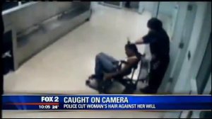 Police Officer Hacks Off Woman's Hair While She's Tied Up In A Chair!