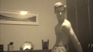 Young ripped boy showing off skinny muscles