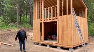 Tiny forest dwelling being built by to young men with little experience.