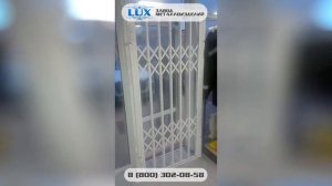 Входная раздвижная решетчатая дверь в магазин