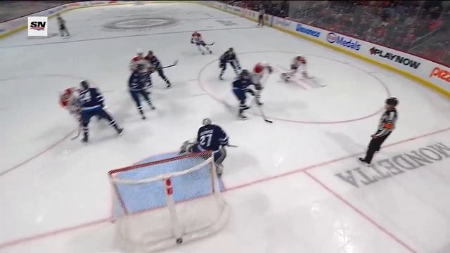 GOTTA SEE IT: Canadiens' Lane Hutson Wires Home Point Shot For First NHL Goal