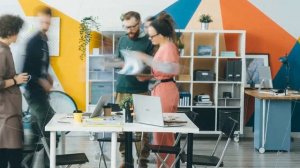 Time lapse of ambitious youth business team working in office together