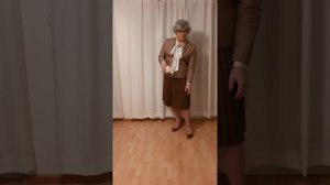 elegant crossdresser - mature lady in pleated leather skirt and silk bow blouse
