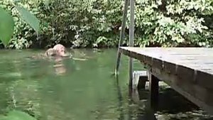 Swim in stream with business suit