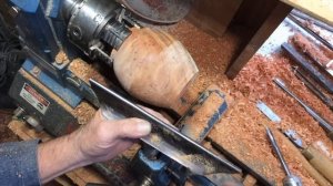 Richard Raffan turns and burns an ironbark pot made from sawmill waste.