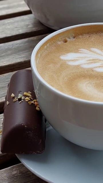 A caffelatte and a pistachio marzipan chocolate at a coffeebar in Porsgrunn.