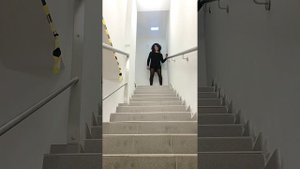 Secretary Crossdresser wearing stilettos on the stairs