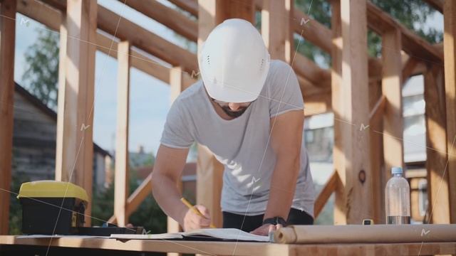 Engineer or foreman at a construction site, working with drawings. смотреть онлайн