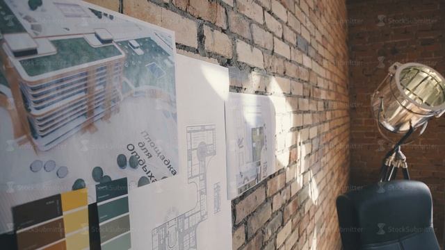 Modern cabinet in the loft style: brick wall with notes and blueprints