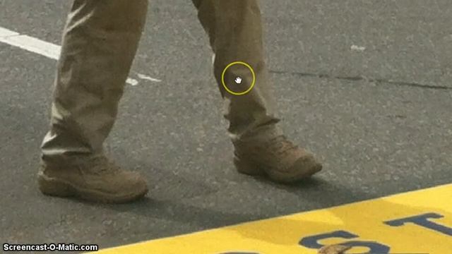 What is this guy holding - Boston Marathon Bombing