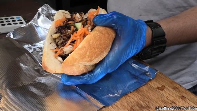 Vietnamese "Banh Mi" Baguette Loaded with Chicken Tasted in London. Street Food of Camden Town