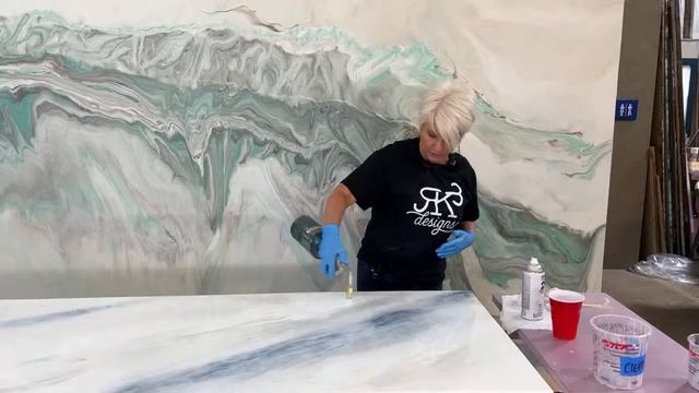 Tuesday Night Live / White marble countertops with blue undertones.