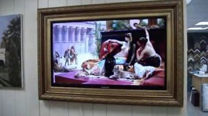 Спрятать телевизор за картину.