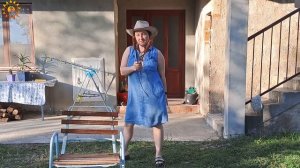 BBQ. Grilled sausages. Cooking in a mountain village. Mila cooking on an open fire. Mila naturist.