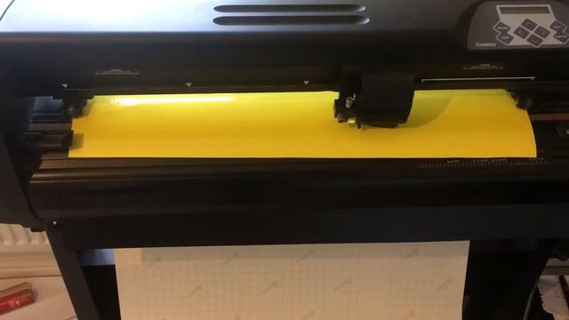 Summa D-60 R vinyl cutter plotter signmaking machine in action cutting vinyl lettering Signwriting