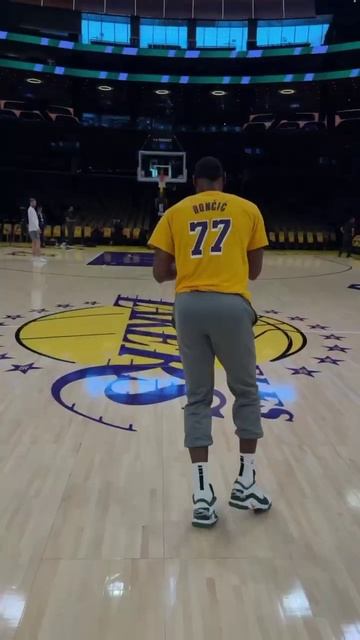 23 + 77 =  - LeBron warms up in the Luka shirt!