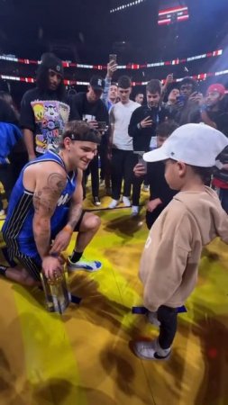 Mac got an orange bracelet & a hug from Luca to go along with his #ATTSlamDunk win!