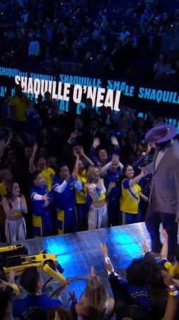 Shaq gets escorted out by a dancing robotic dog