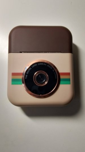 Обзор фотоаппарата моментальной печати.