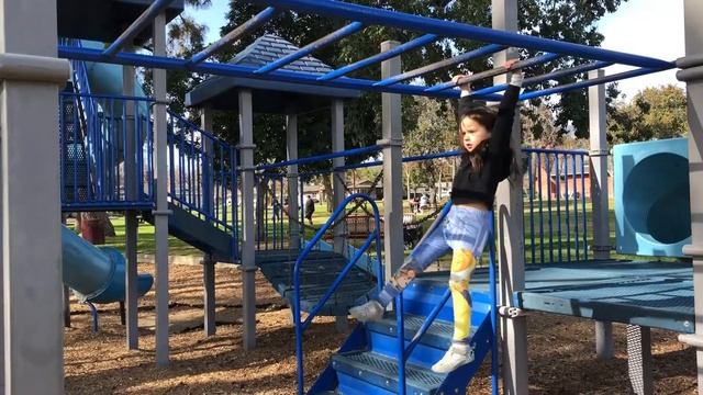 Ava conquered the monkey bars!