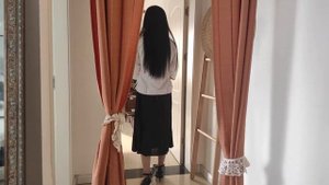Chinese woman in handcuffs and leg irons