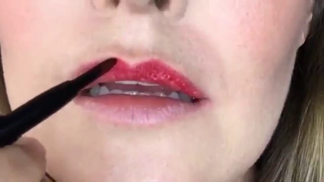 Dusk by Adele vegan red lipstick application