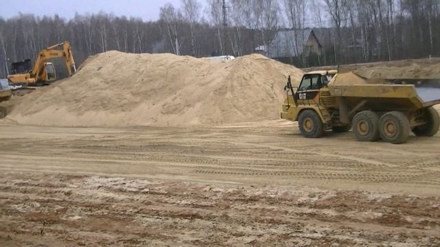 Cat 730 ADT`s unloading
