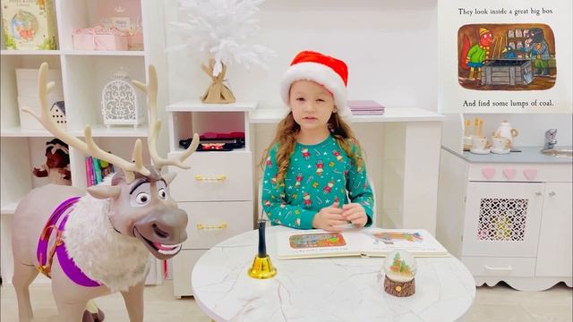 Sophie reads Squirrels Snowman by Julia Donaldson.